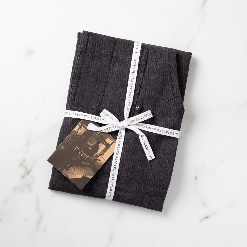 Apron Packaged for Gift Giving in Reluctant Trading Printed Cloth Tape