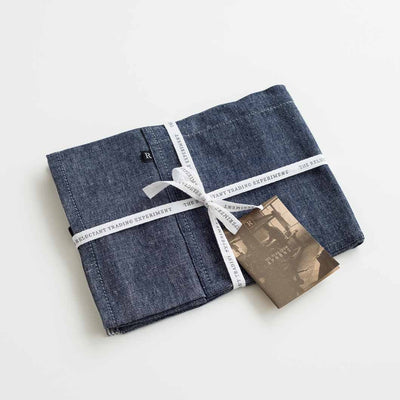 Aprons packaged in branded, cloth tape for gift giving, Reluctant Trading